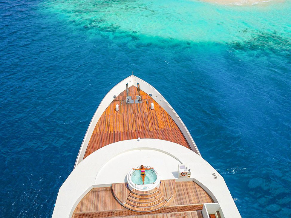 Liveaboard bow with woman in jacuzzi