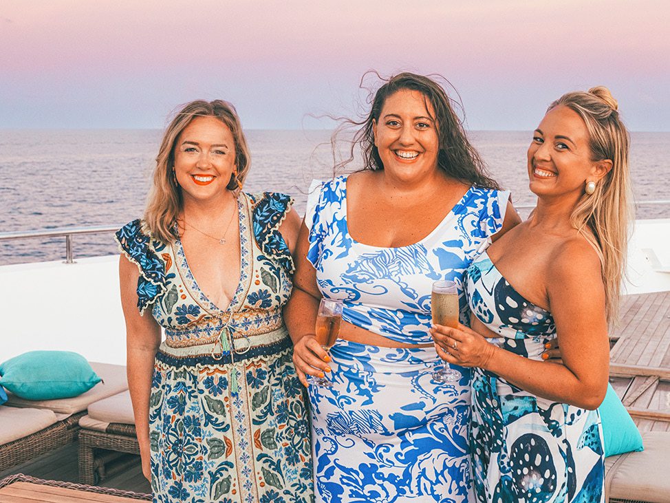 Alex + two guests on liveaboard rooftop