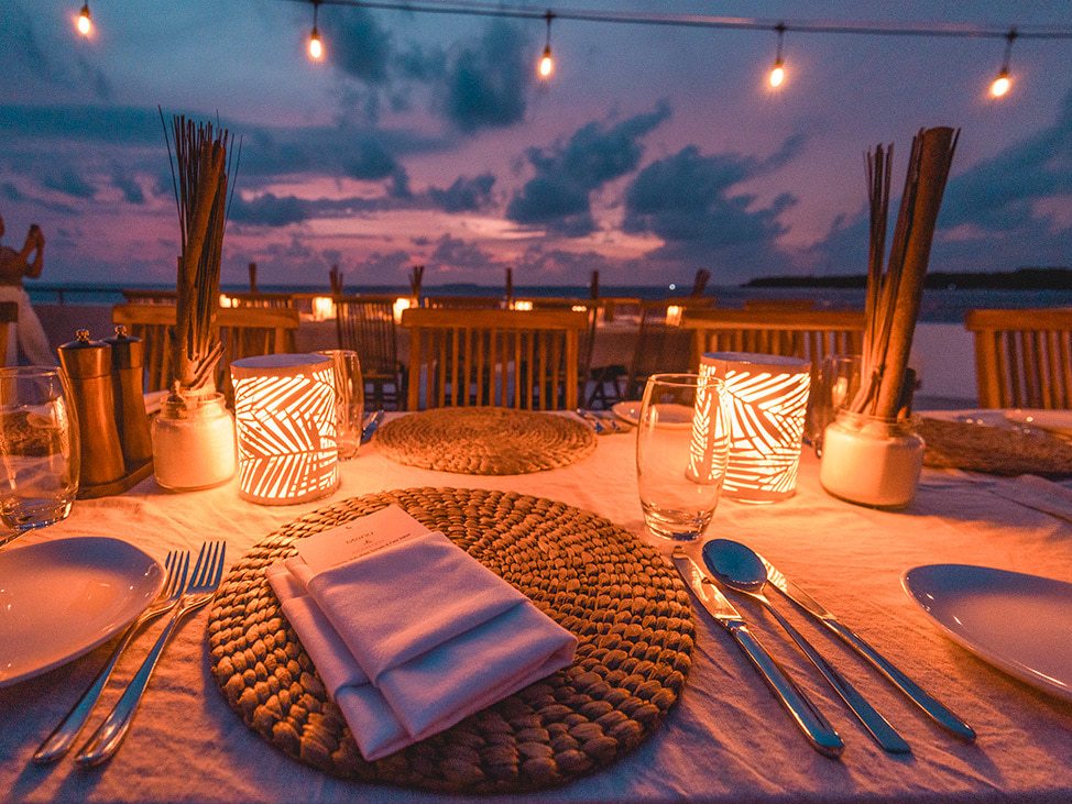 Sunset dinner setup on beach