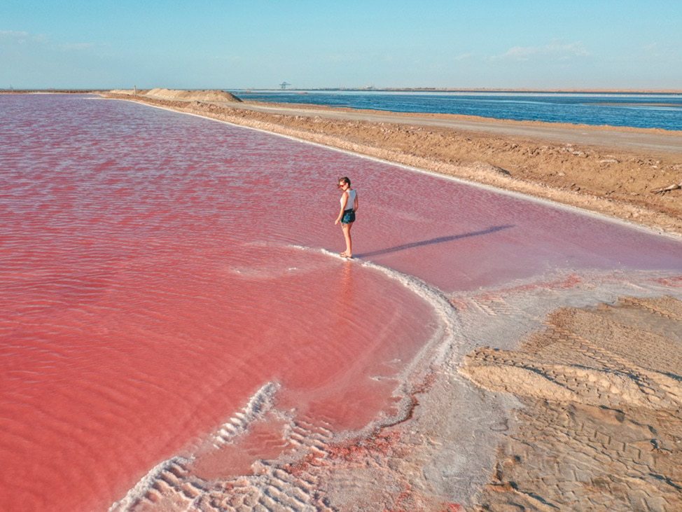 Woman walking in Walvis Bay Lagoon Namibia