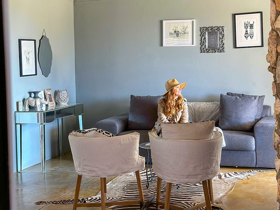 Woman on couch with safari hat Namibia