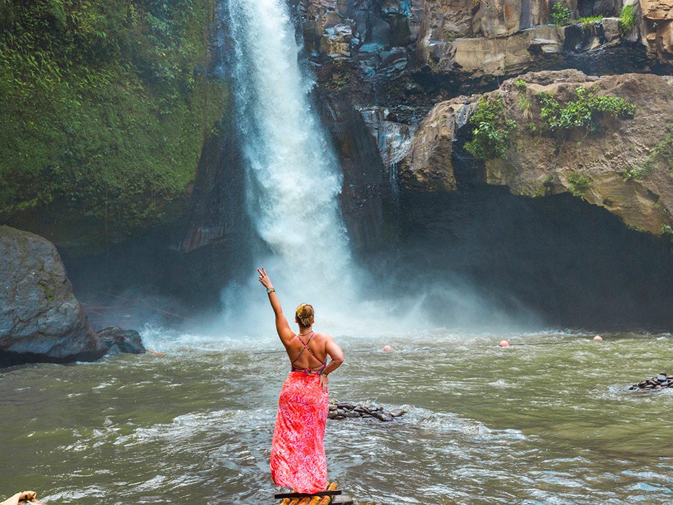 Woman in front of waterfall in Sri Lanka
